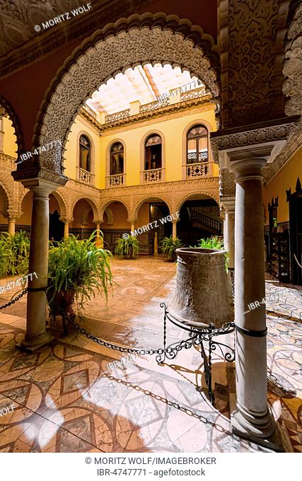 16th century palace with Arabian architecture, courtyard with artistic arcade and Roman mosaic, Palacio de la Condesa de Lebrija, Seville, Andalusia, Spain