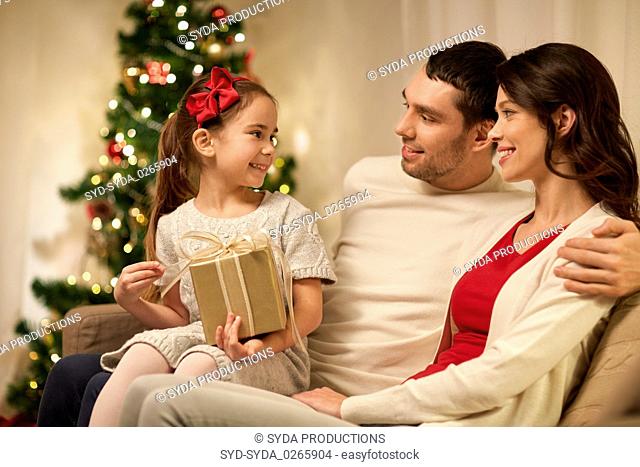 happy family with christmas present at home