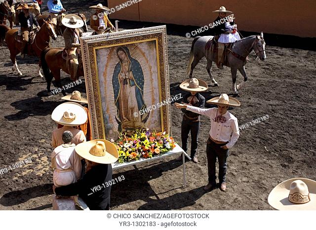 Charros carry an image of the Our Lady of Guadalupe during a rodeo competition in Mexico City, November 16, 2008