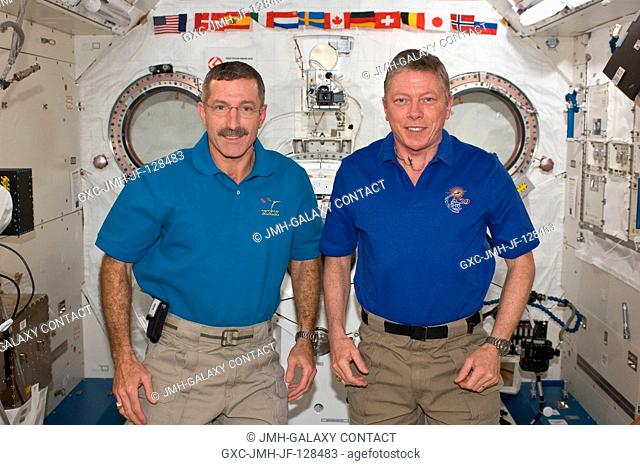 NASA astronauts Dan Burbank (left), Expedition 30 commander; and Mike Fossum, Expedition 29 commander, pose for a photo in the International Space Station's...