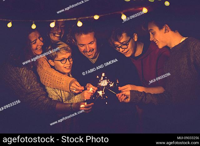 Night party celebration like new year eve 2019 or chsristams for caucasian big modern family using sparkles light fireworks together in friendship having fun -...