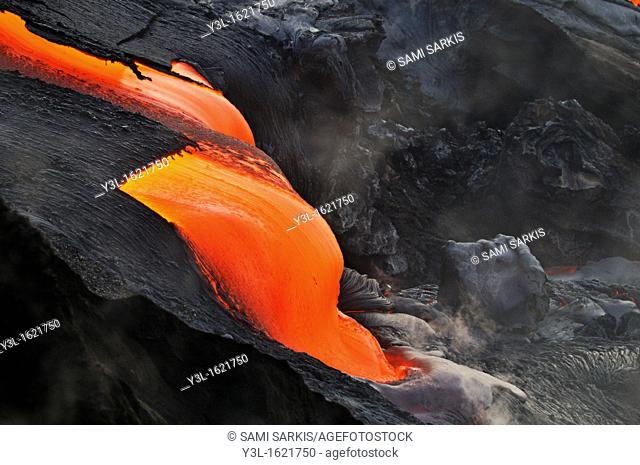 River of molten lava flowing to the sea at sunrise, Kilauea Volcano, Big Island, Hawaii Islands, USA