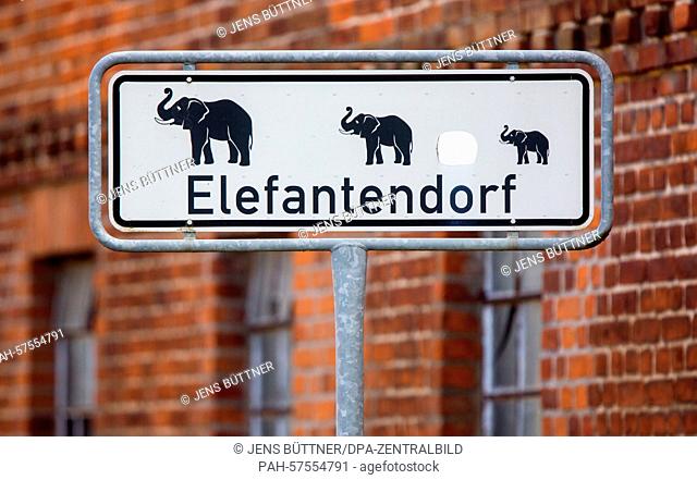 A sign at the entrance of the village reading 'Elefantendorf' (elephant village) points at the elephant farm Platschow, Germany, 02 April 2015