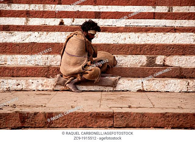 Man sitting on the ghats  Varanasi, Benares, Uttar Pradesh, India