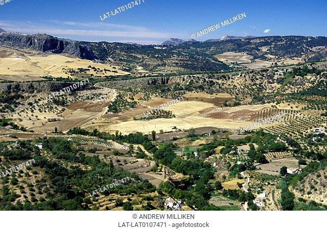 Serrania de Ronda. Landscape. View from Ronda town. Fields, crops. Houses, villages