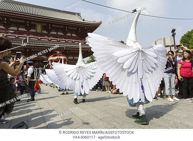 Herons hooded dancers perform during the Daigyoretsu or Large Parade of Sanja Matsuri Festival at Sensoji Temple in Asakusa on May 18, 2018, Tokyo, Japan