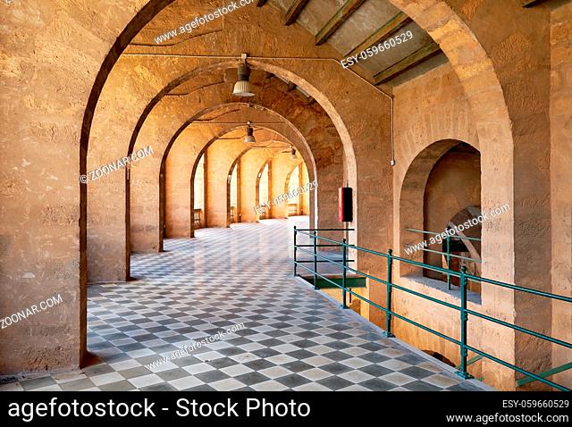 Inside of bullring coliseum of Palma de Mallorca, empty archway inside of old historic building, Balearics Islands, Spain