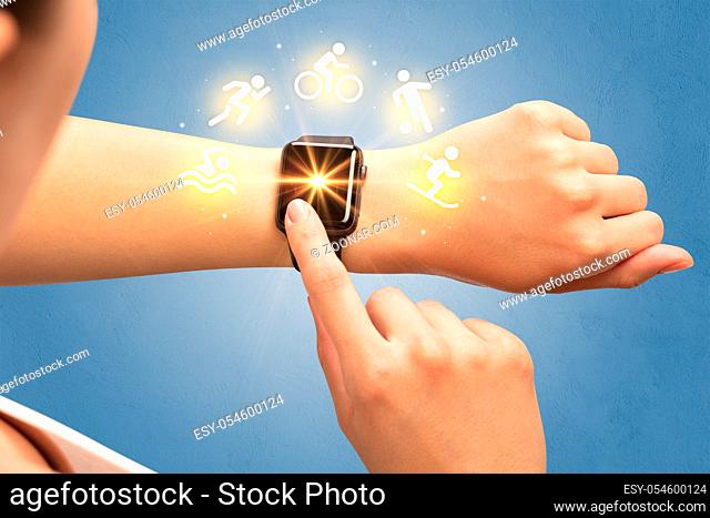 Female hand with smartwatch and sport concept