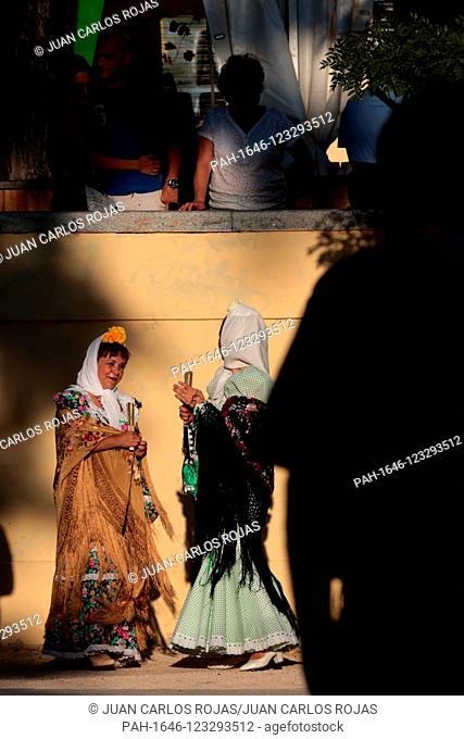 Madrid Spain; 08/15/2019. Women pose with their Manila Shawls for a photographer..Summer parties in Madrid, Spain. La Virgen de La Paloma a small painting that...