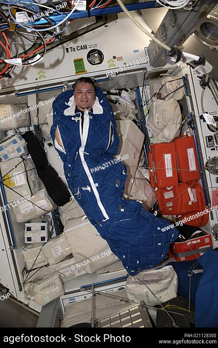NASA astronaut and Expedition 67 Flight Engineer Kjell Lindgren poses for a portrait inside a crew sleeping bag aboard the International Space Station (ISS) in...