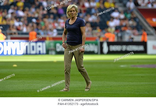 Head coach Silvia Neid (R) of Germany stay on the pitch before the UEFA Women«s EURO 2013 final soccer match between Germany and Norway at the Friends Arena in...