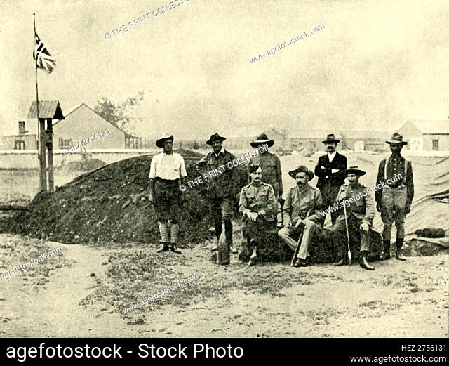'General Baden-Powell, Lord Edward Cecil, and Other Officers, at the Entrance to their Dug-Out.', Creator: D Taylor