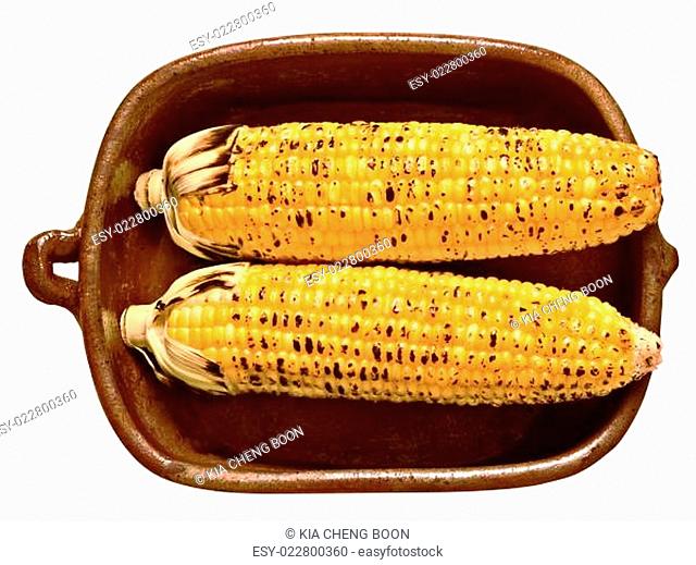 rustic golden grilled corncob