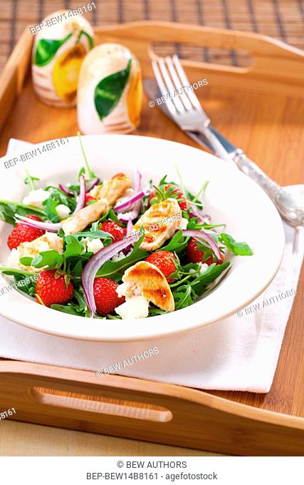 Grilled chicken with arugula, strawberries and bryndza cheese