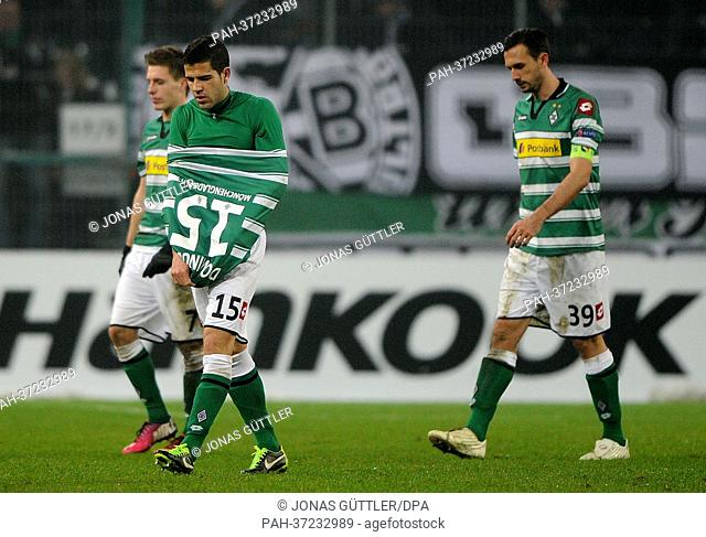 Moenchengladbach's Patrick Herrmann (L-R), Alvaro Dominguez and Martin Stranzl look dejected after the UEFA Europa League Round of 32 first leg soccer match...