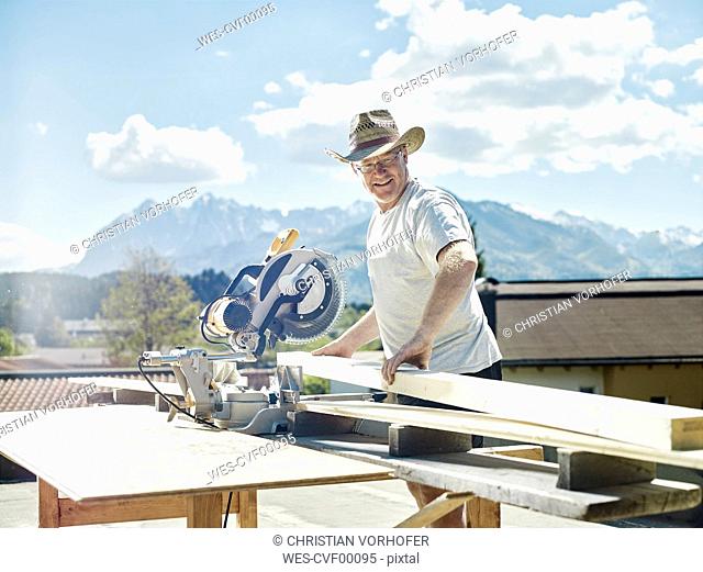 Carpenter working, circular saw