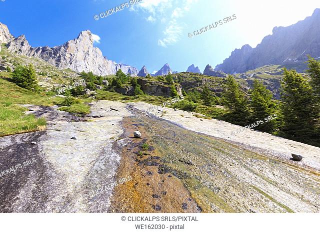 A water ripple flows on a rock plain in Torrone Valley, Valmasino, Valtellina, Sondrio province, Lombardy, Italy