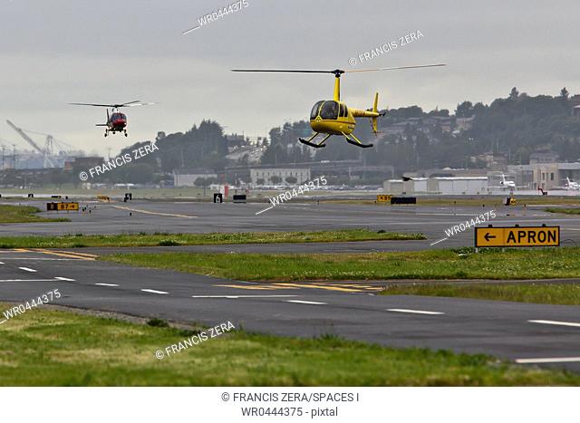 Helicopters Landing on a Runway