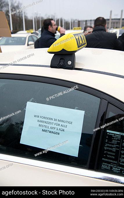 03 March 2020, Berlin: Numerous taxi drivers are demonstrating on the Olympic Square against the plans of the Federal Ministry of Transport to open up their...