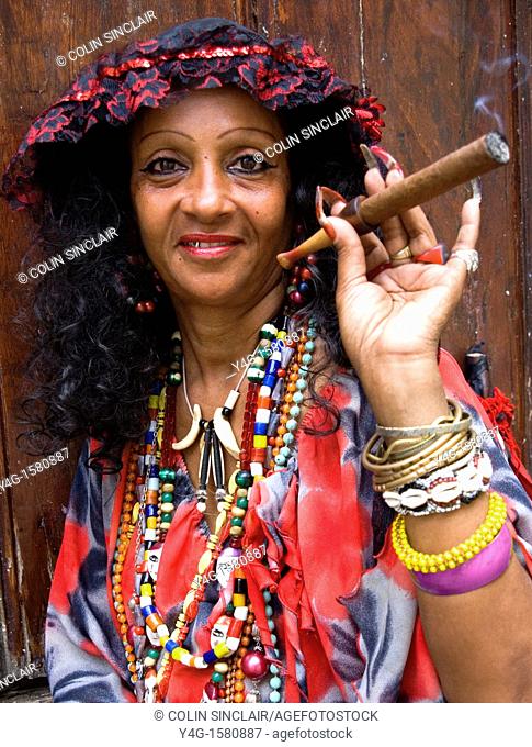 Lady in Traditional dress with cigar, Old Havana, Havana, Cuba