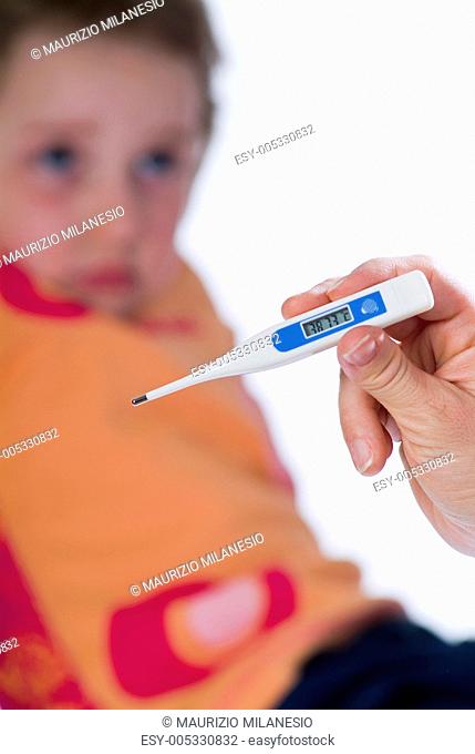 Sick child measuring fever