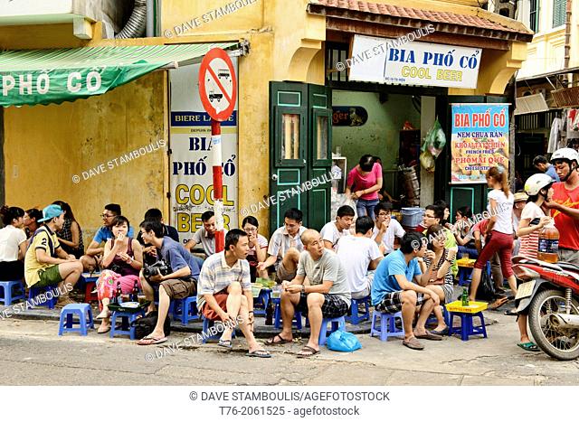 enjoying draft beer on the Bia Hoi Corner in Hanoi, Vietnam