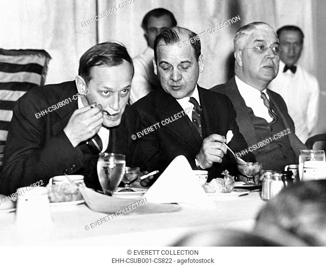 Harry Hopkins dining and smoking with politicians in May, 1935. L-R: Harry Lyman Davis, Mayor of Cleveland; Stanley Orr; Harry Hopkins