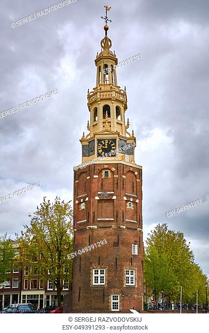 Tower (Montelbaanstoren) on Bank of the Canal Oudeschans in Amsterdam, Netherlands