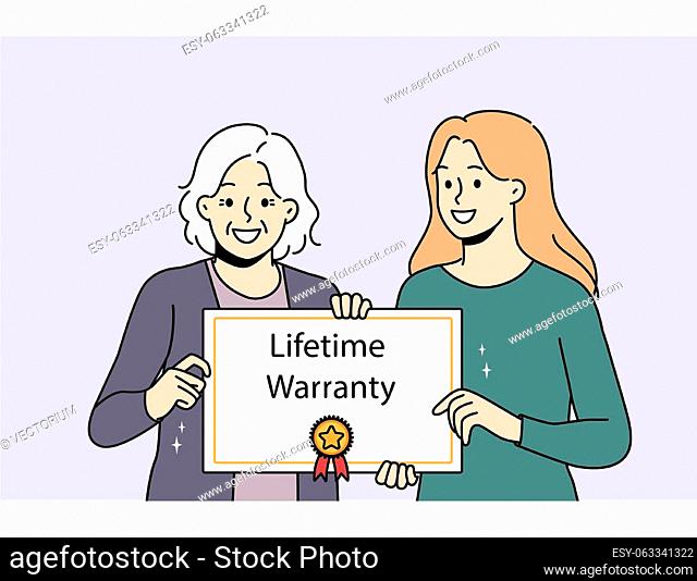 Smiling caregiver with elderly patient holding lifetime warranty food good quality service. Happy mature woman with guarantee assurance certificate in hands