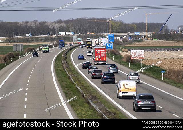 25 March 2020, Baden-Wuerttemberg, Herbolzheim: Trucks and cars travel on the A5 motorway. Traffic on the Autobahn 5 Karlsruhe-Basel is to be distributed to...
