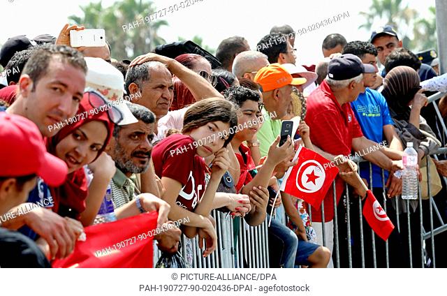 27 July 2019, Tunisia, Tunis: People attend the funeral of the late Tunisian President Beji Caid Essebsi. The 92-year-old died on Thursday almost five years...