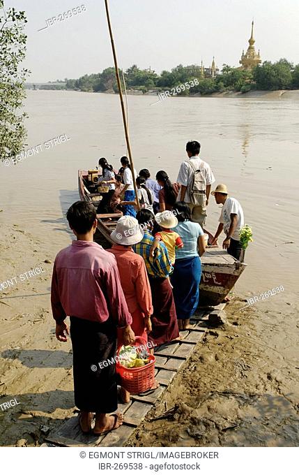 People entering a ferry over the Pazundaung river, Yangon, Myanmar