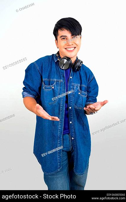 Portrait of young asian man with headphone on white background with studio light