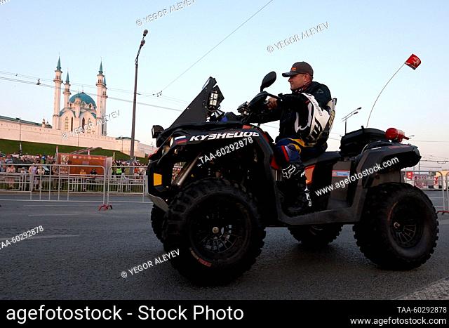RUSSIA, KAZAN - JULY 6, 2023: A man rides a quadracycle as a ceremony to start the 2023 Silk Way Rally takes place in Millenium Square