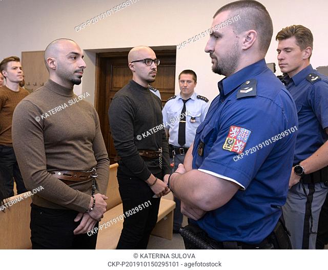 Dutch brothers Arash (left) and Armin Nahvi sits during a court appearance in Prague, Czech Republic, Tuesday, Oct. 15, 2019
