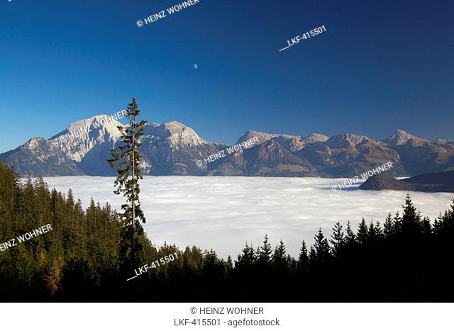View over the fog in the valley to Hoher Goell and Hohes Brett in the moonlight, Berchtesgaden region, Berchtesgaden National Park, Upper Bavaria, Germany