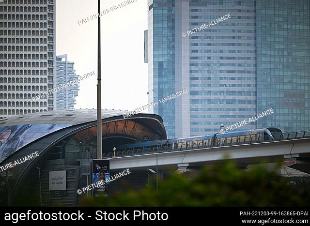 02 December 2023, United Arab Emirates, Dubai: The metro arrives at the World Trade Centre station in the city center in the morning