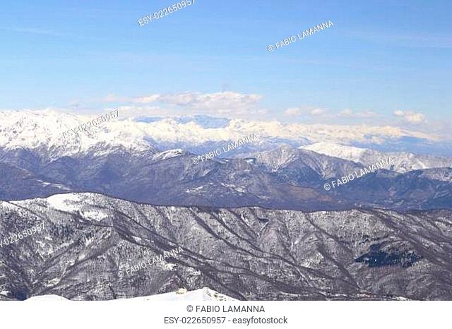 Off piste snowy slope in majestic high mountain frozen scenery and infinite view, winter in the italian Alps
