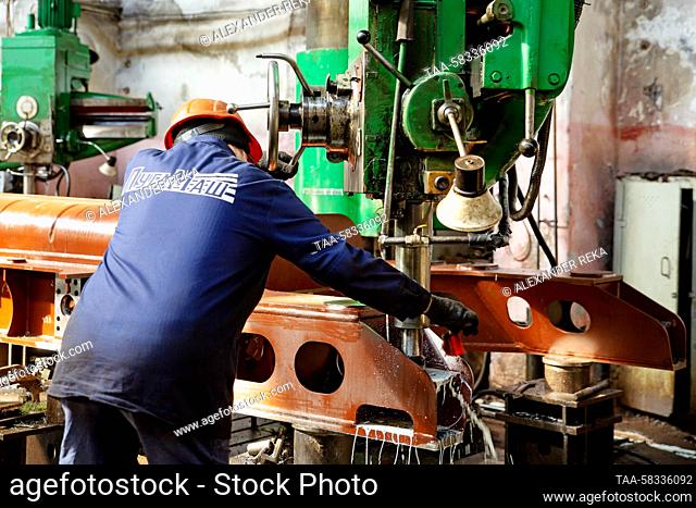 RUSSIA, LUGANSK - APRIL 10, 2023: An employee is at work at the Lugamash machine building enterprise. The enterprise, established in 2015