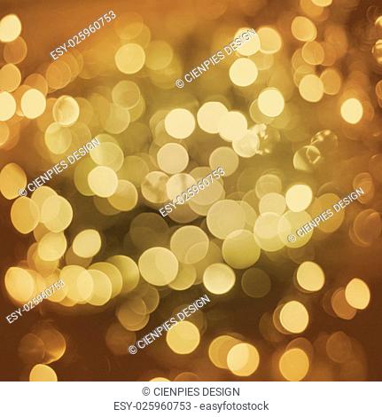 Gold sparkle blur light elegant retro background. Ideal for holiday greeting card, event or party invitation