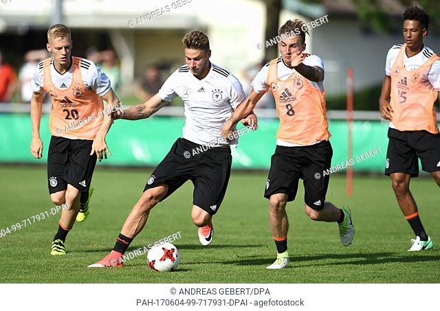 Timo Baumgartl (l-r), Felix Platte and Maximilian Philipp in action during a training session at the European Championship training camp of the German U21...