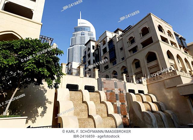 District built in the traditional style, Downtown Dubai, The Old Town, in front of a skyscraper, The Address, a luxury hotel, Dubai, United Arab Emirates