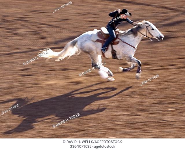 Barrel racing cowgirls at the Tucson Rodeo in Tucson, Arizona, United States
