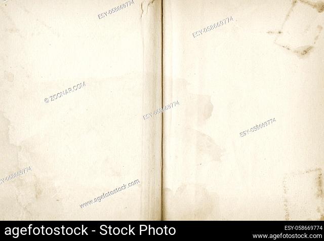 Old stained open book. Background texture wallpaper