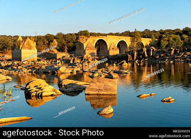 Destroyed abandoned Ajuda bridge crossing the Guadiana river between Spain and Portugal