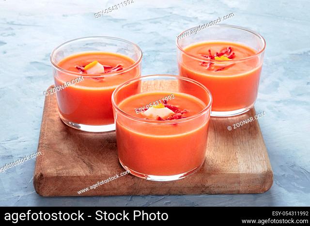 Salmorejo, Spanish chilled tomato and bread soup, served in glasses, with copyspace
