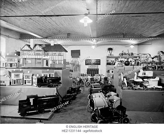 Toyshop, Oldham Road, Manchester, 1927. Dolls houses, trains, pedal cars and other toys displayed in the Triang Toy Shop in Oldham Road in Manchester