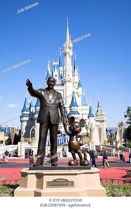 Walt Disney World Resort. Walt Disney and Mickey Mouse Partners statue in front of Cinderella’s castle in the Magic Kingdom