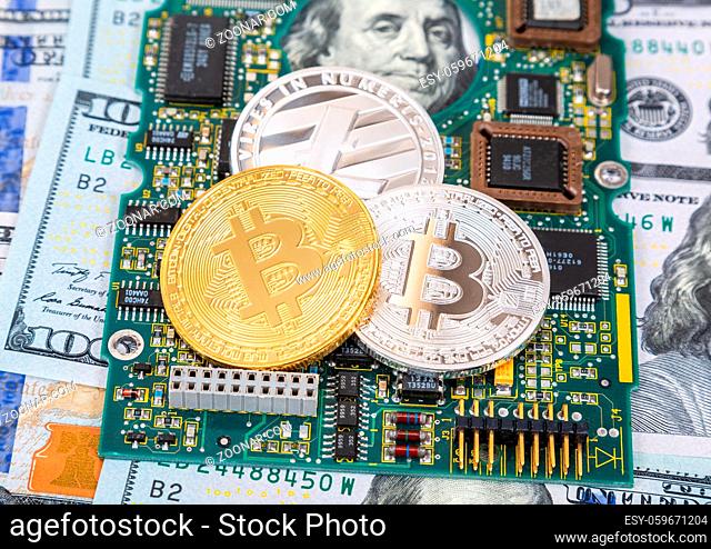 Digital cryptocurrency bitcoin, electronic computer component and american dollars. Business concept of new virtual money