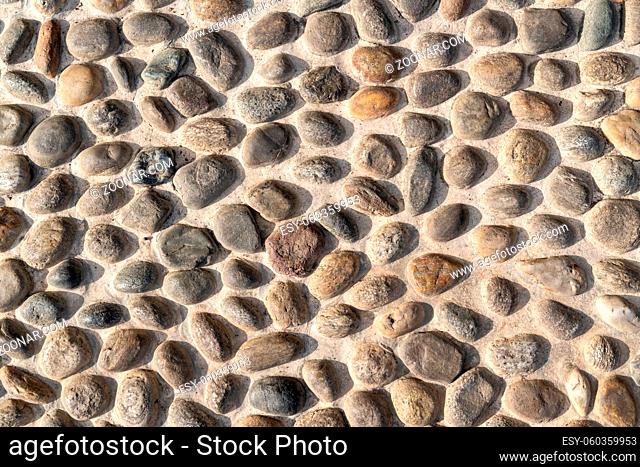 Old natural stone wall, background, texture or pattern. Rustic texture. Wall with bricks of italian stones